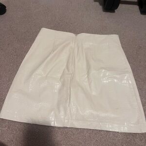 Francesca’s white pleather snake skin skirt.